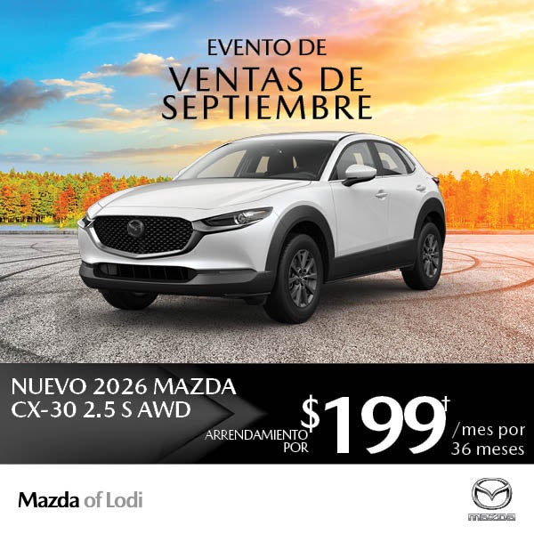 White 2026 Mazda CX-30 SUV against an autumn sunset